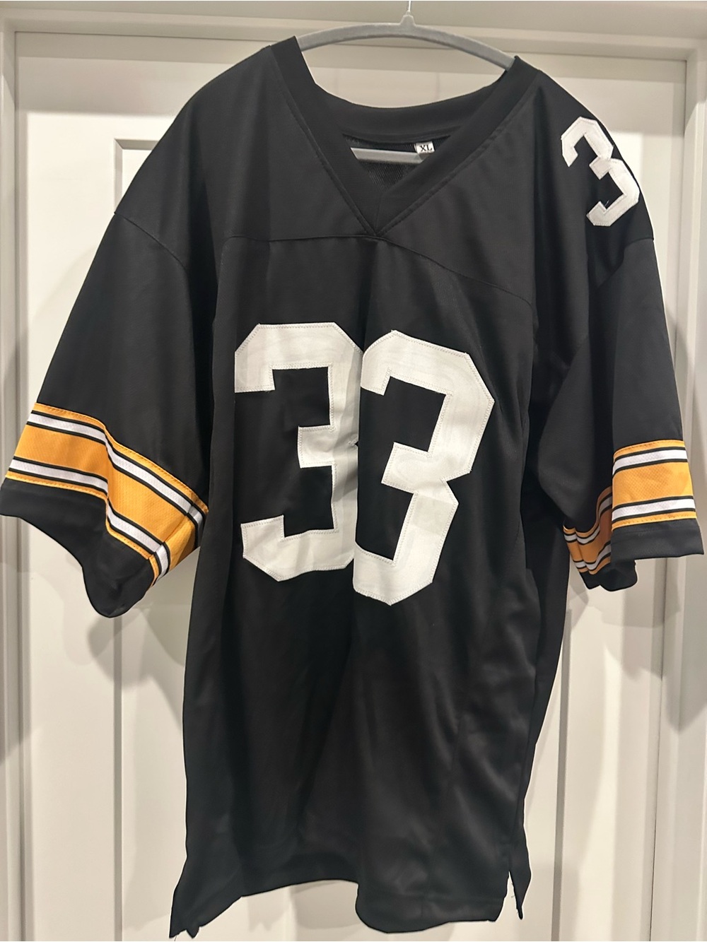 Black Football Jersey with White Numbers and Gold Stripe Sleeves